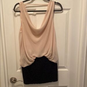 Chic Sleeveless Blouse with Black Lace Skirt